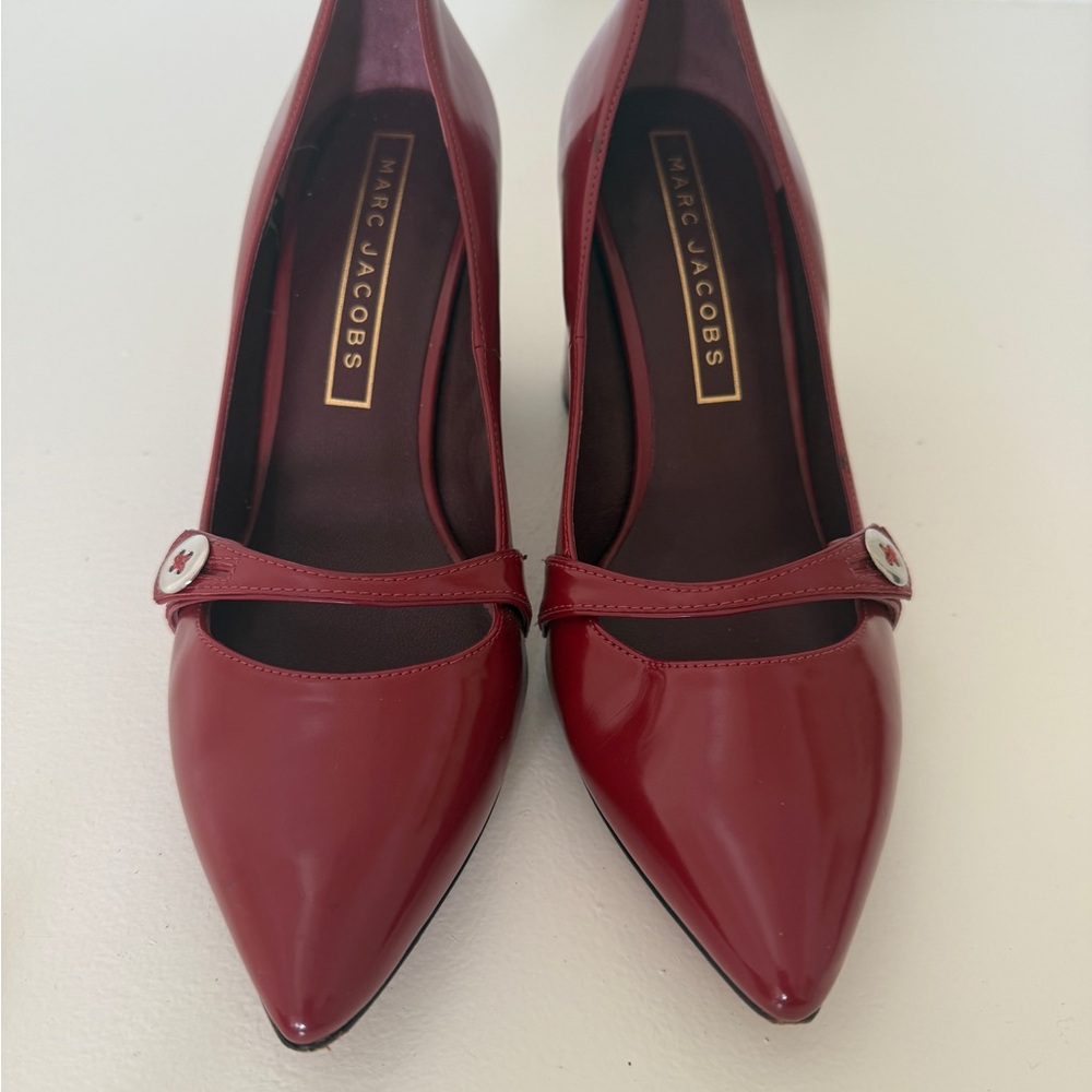 Marc Jacob’s designer pumps. Deep red patent leather. Like new condition.